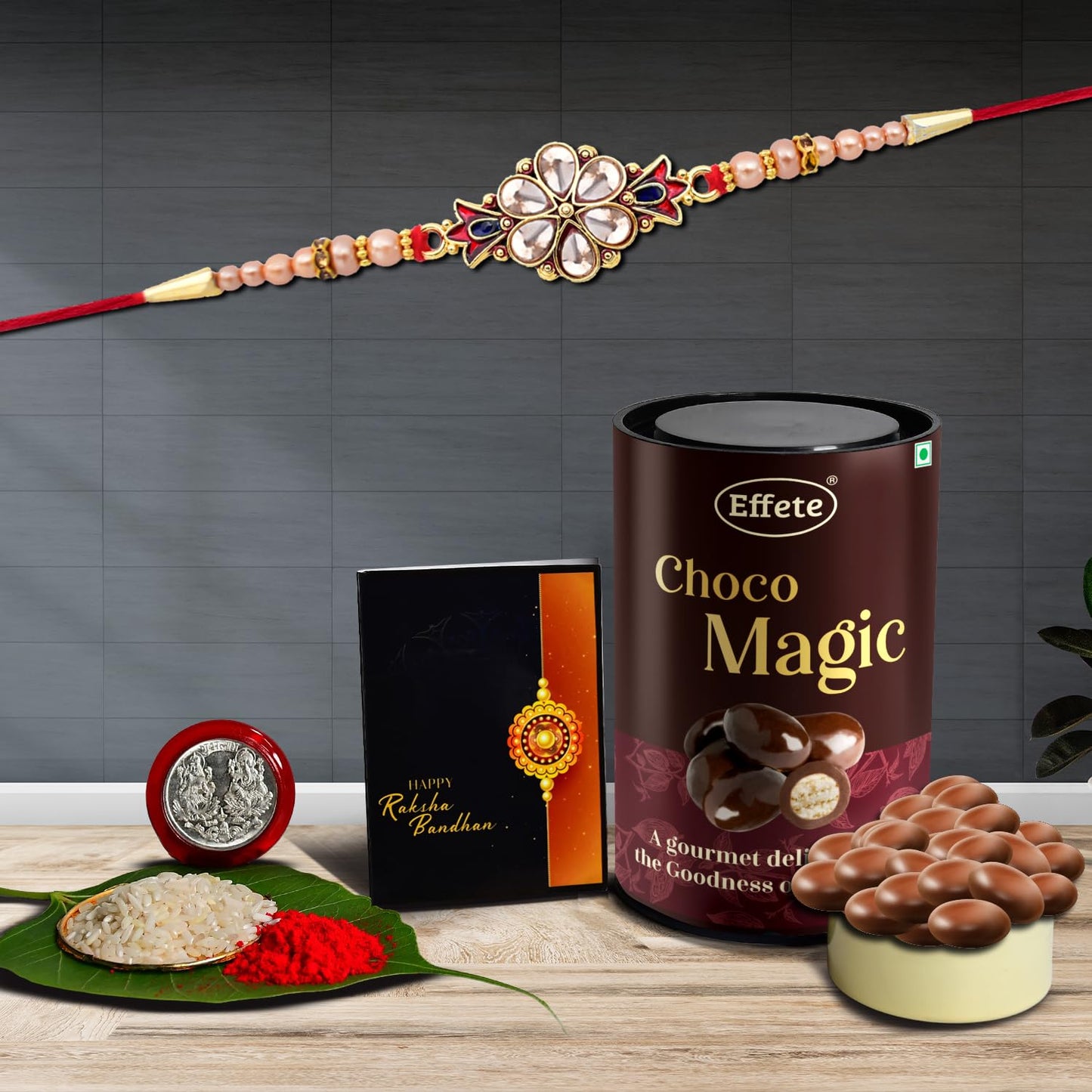 Wukusy Rakhi combo with Chocolate Magic Rakhi and chocolates for brother, featuring a decorative chocolate-themed Rakhi and gift set.