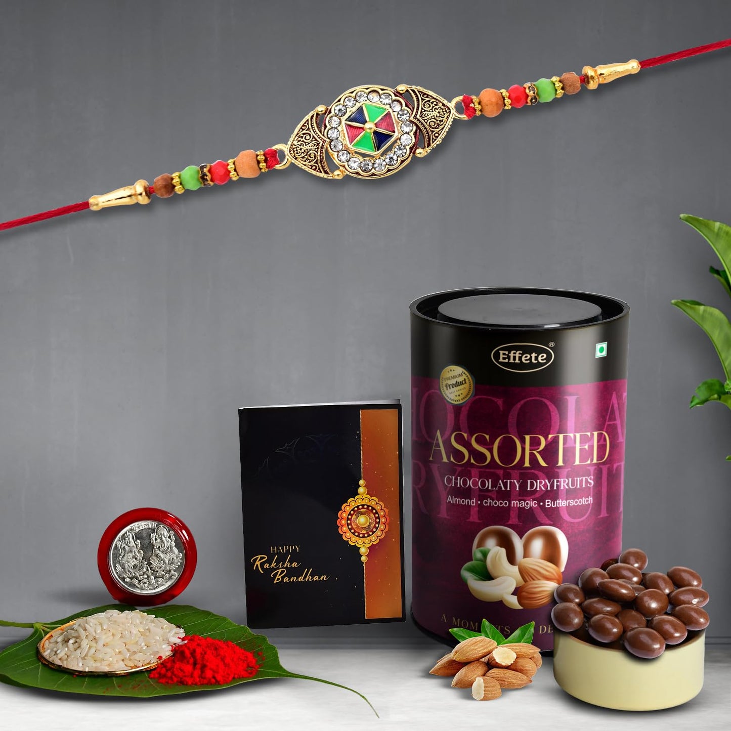 Wukusy Rakhi combo with assorted chocolate and dry fruits, featuring a decorative fancy Rakhi and chocolate gift pack for brothers.