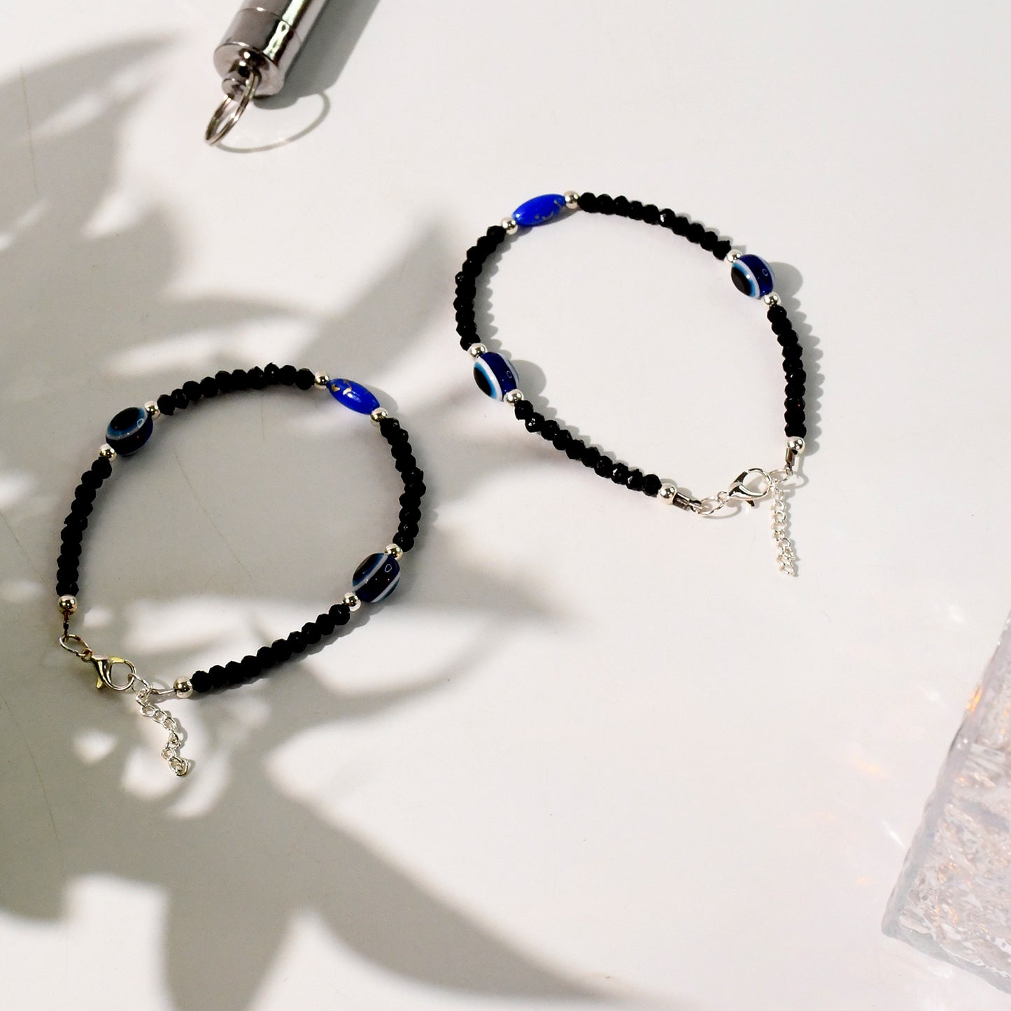 Black bead evil eye protection bracelet set by Wukusy featuring adjustable design and traditional beaded details.