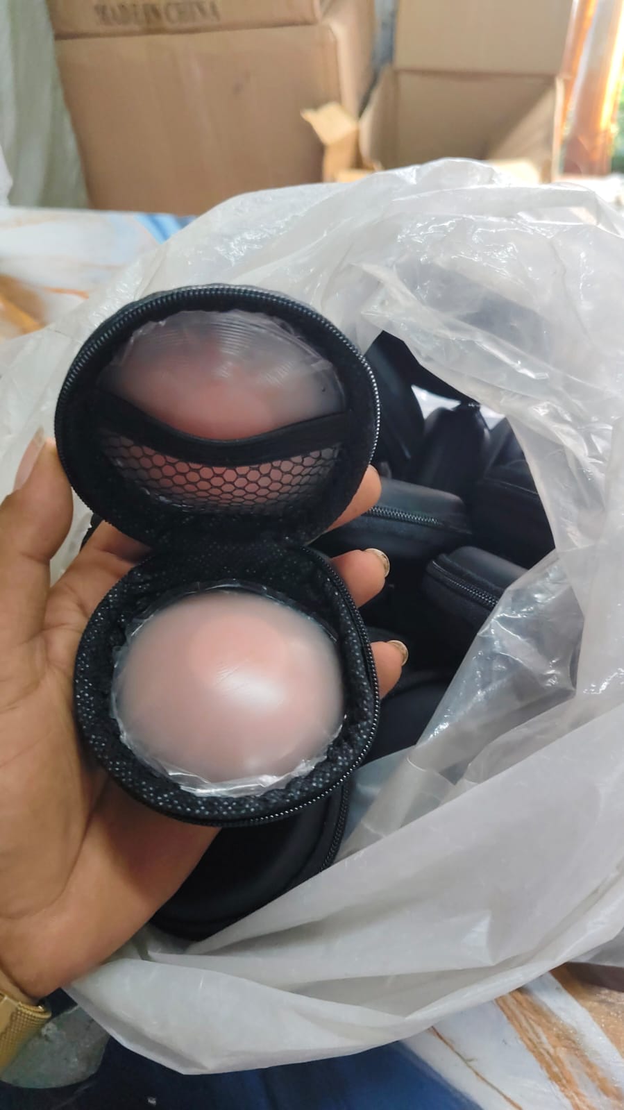 Dropdash reusable silicone nipple covers on a plain white T-shirt, showing the soft, transparent material and smooth finish.