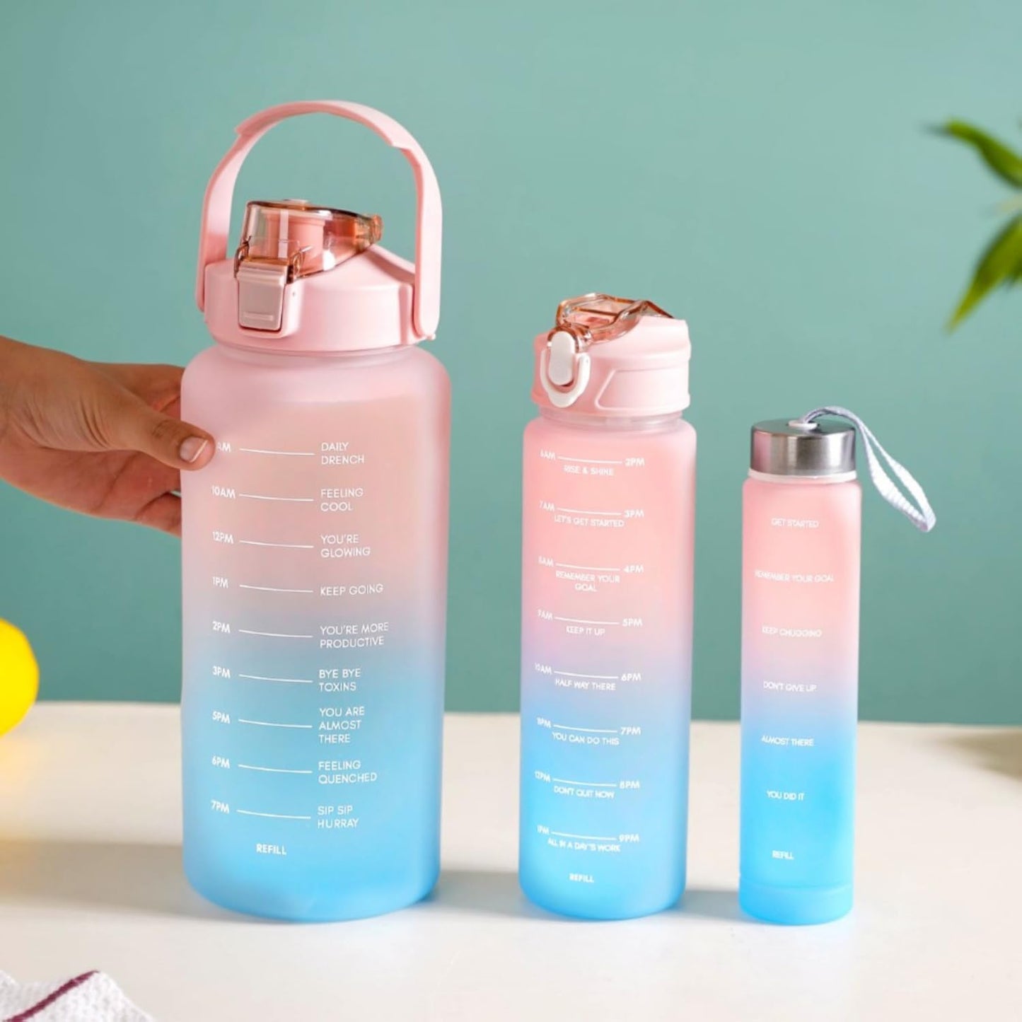 Set of three Drpshippr water bottles with motivational time markers for hydration tracking and daily water intake.