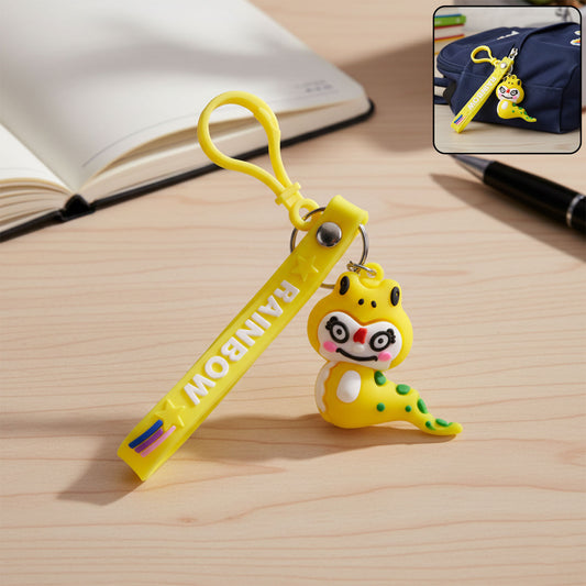 Cute cartoon dinosaur keychain by Wukusy featuring a colorful, smiling dinosaur charm attached to a metal keyring.