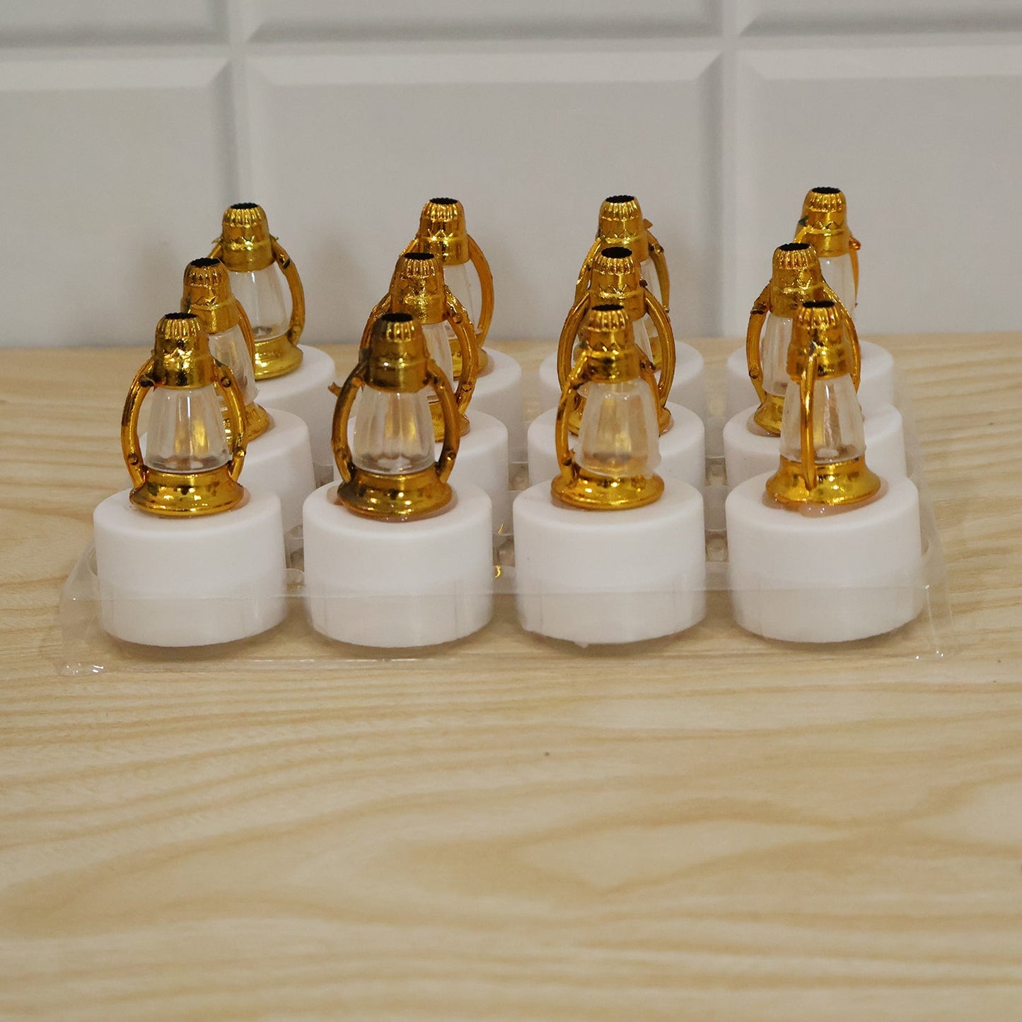 Set of 12 Wukusy Golden Lantern LED decorative candle lamps for home and Diwali decor, featuring intricate design and warm lighting.