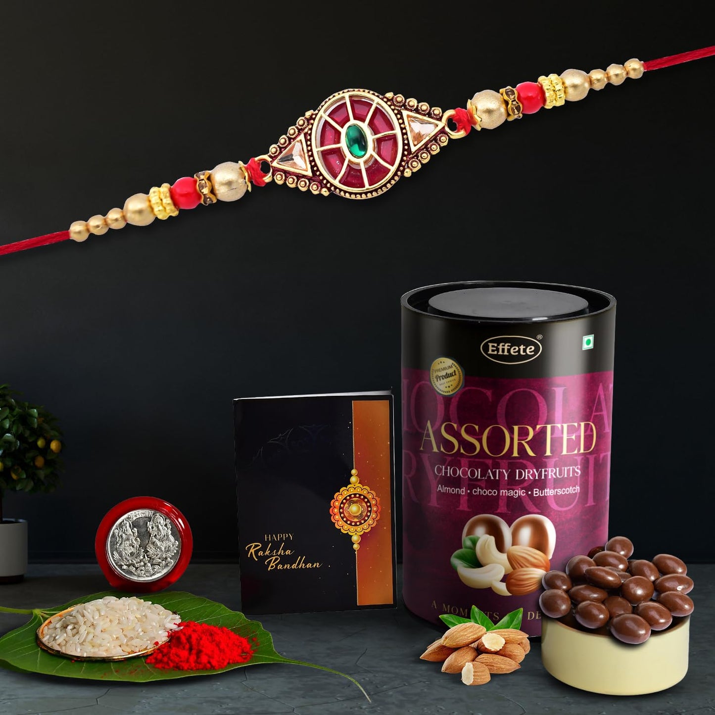 Wukusy Rakshabandhan red design Rakhi for brother with assorted chocolates and dry fruits in a gift set.