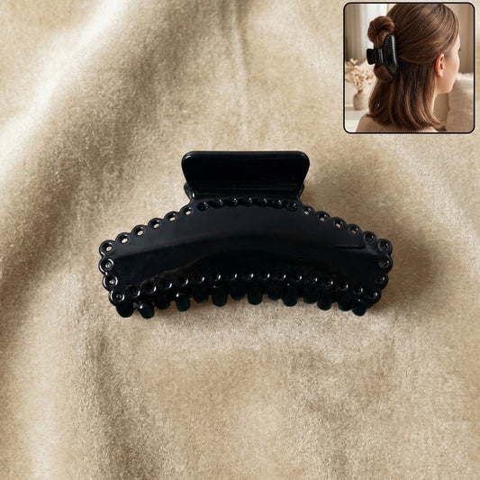 Black hair claw clip by Wukusy, stylish and elegant, holding hair securely with a sleek design, perfect for everyday use.
