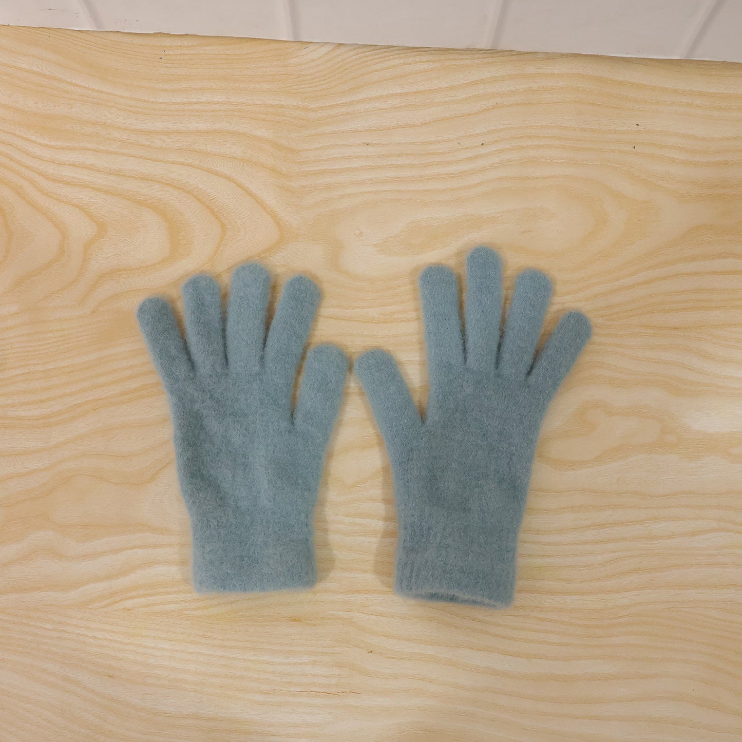 Pair of Wukusy ultra soft fleece winter gloves for men and women, shown in a close-up image.