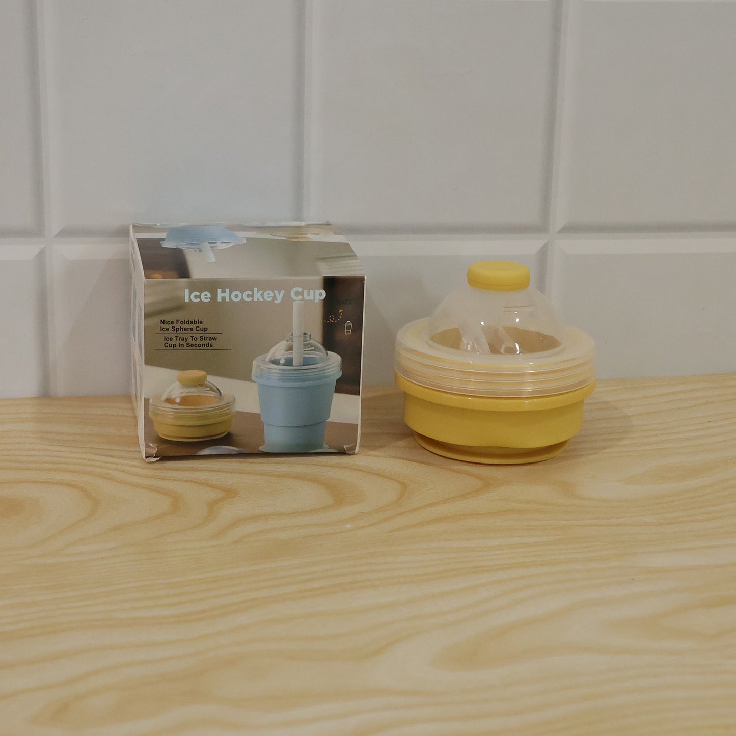 Wukusy silicone foldable travel cup with straw and dome lid, collapsible design ideal for portable hydration.