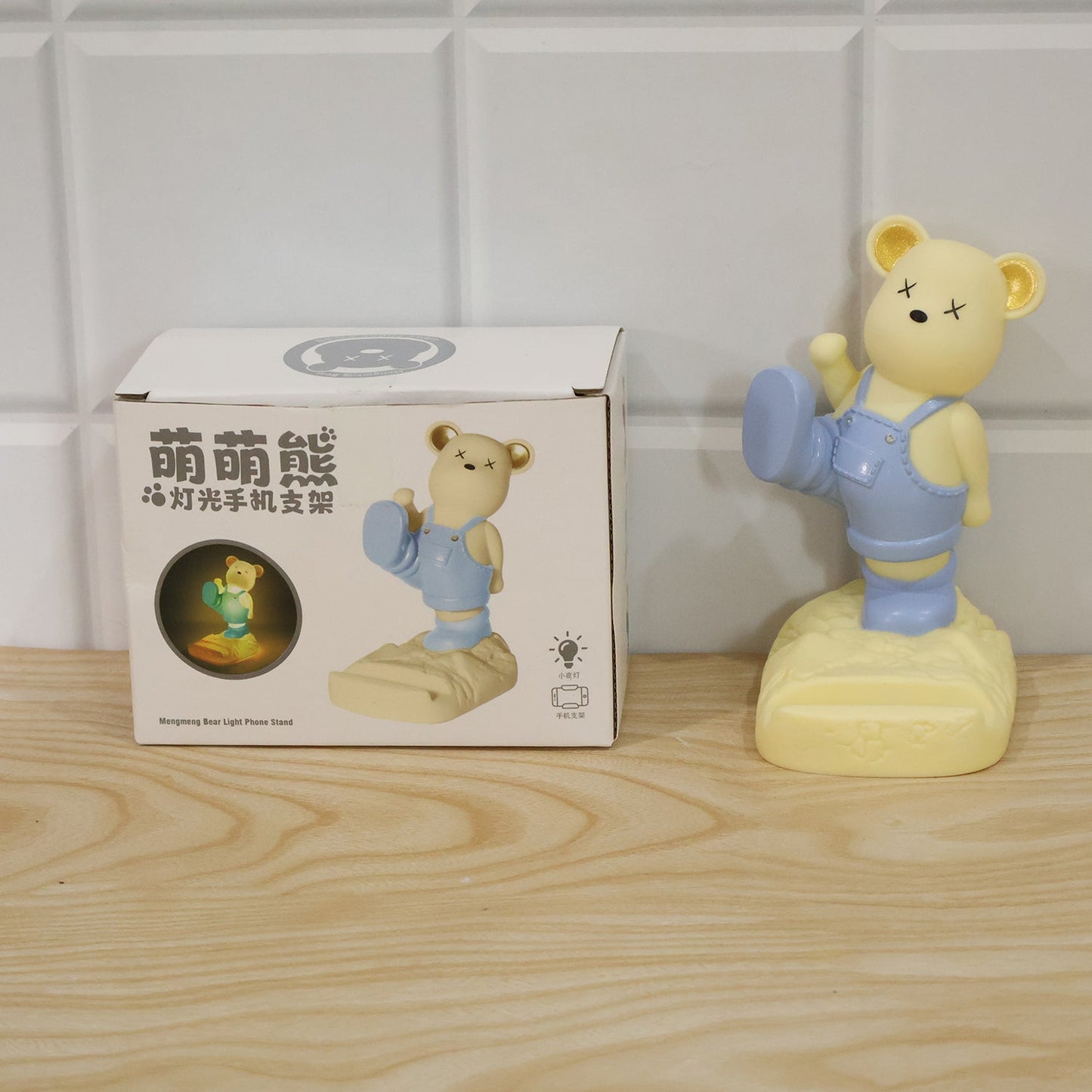 Wukusy magnetic bear LED light phone stand night lamp on desk, designed for kids' rooms and night-time use, featuring a playful bear shape.