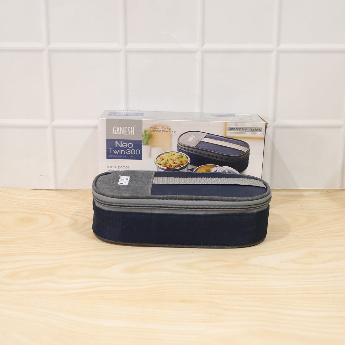 Wukusy Ganesh Neo Twin 300 stainless steel lunch box set with two compartments, durable and sleek for everyday use