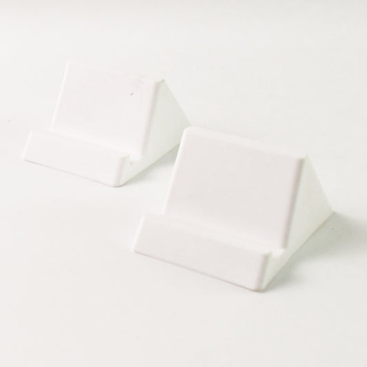 Two Wukusy compact plastic mobile phone holder stands in mixed colors, designed for hands-free support and easy viewing.