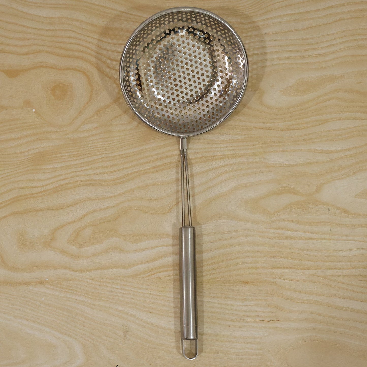 Wukusy stainless steel frying strainer skimmer spoon with long handle, ideal for draining and serving fried foods.