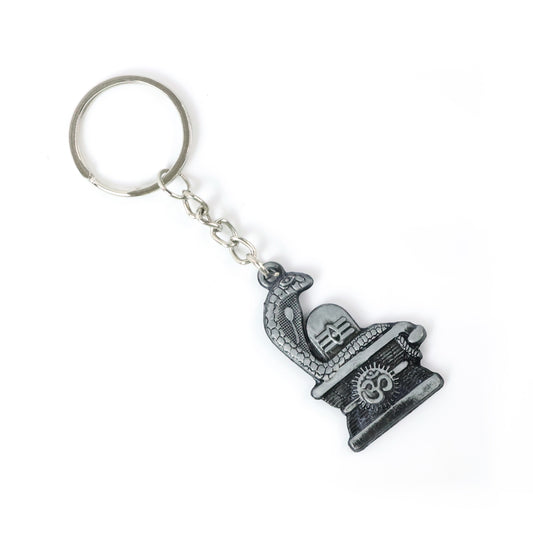 Silver Shivling with snake design keychain by Wukusy, detailed metal charm featuring spiritual symbolism and intricate craftsmanship.