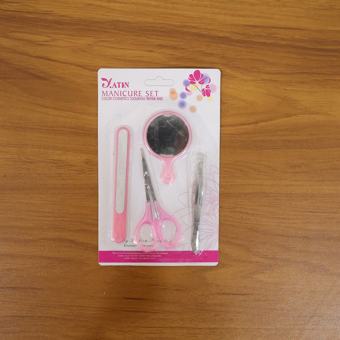 Wukusy 4-in-1 manicure and pedicure grooming kit with nail clippers, file, scissors, and cuticle tools on a white background.