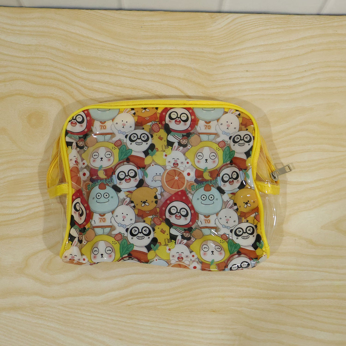 Wukusy multipurpose PVC cosmetic pouch with cartoon print and zip compartments for travel storage and organization.