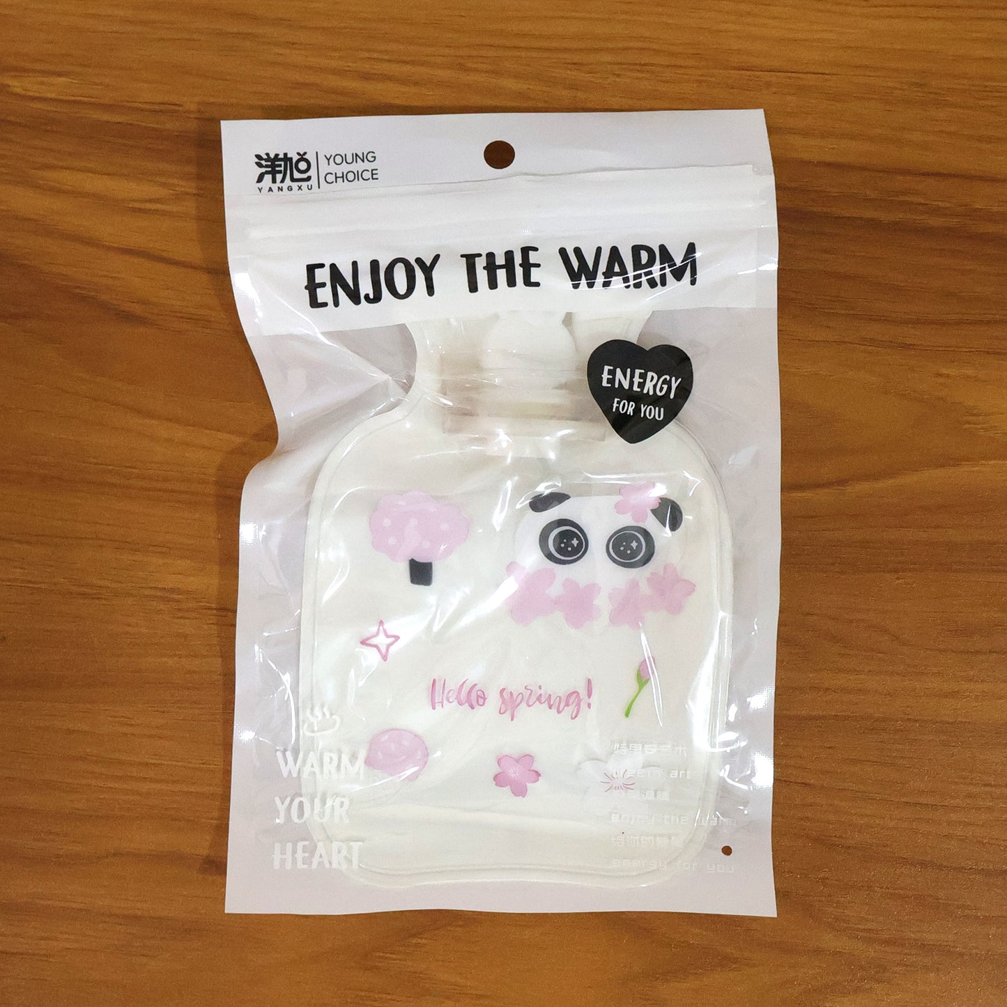 Cute Wukusy printed mini hot water bag, 16x11 cm, showing colorful floral design and soft fabric for soothing warmth.