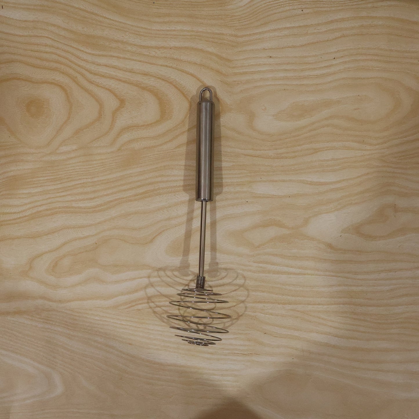 Wukusy stainless steel large round spring whisk for kitchen cooking, designed for beating eggs and mixing ingredients efficiently.