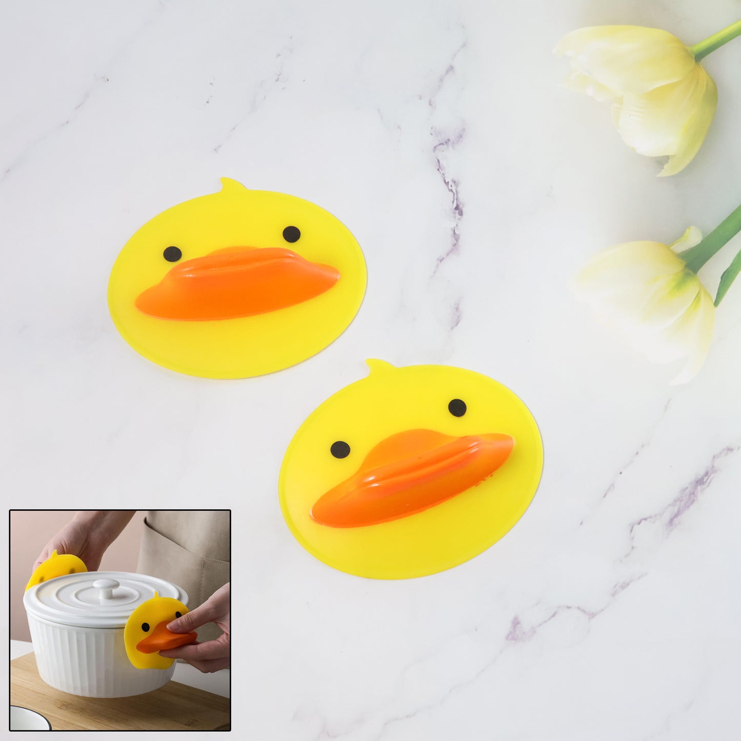 Two cute duck-shaped silicone hot pot holders by Wukusy, featuring bright yellow and orange designs for kitchen safety.