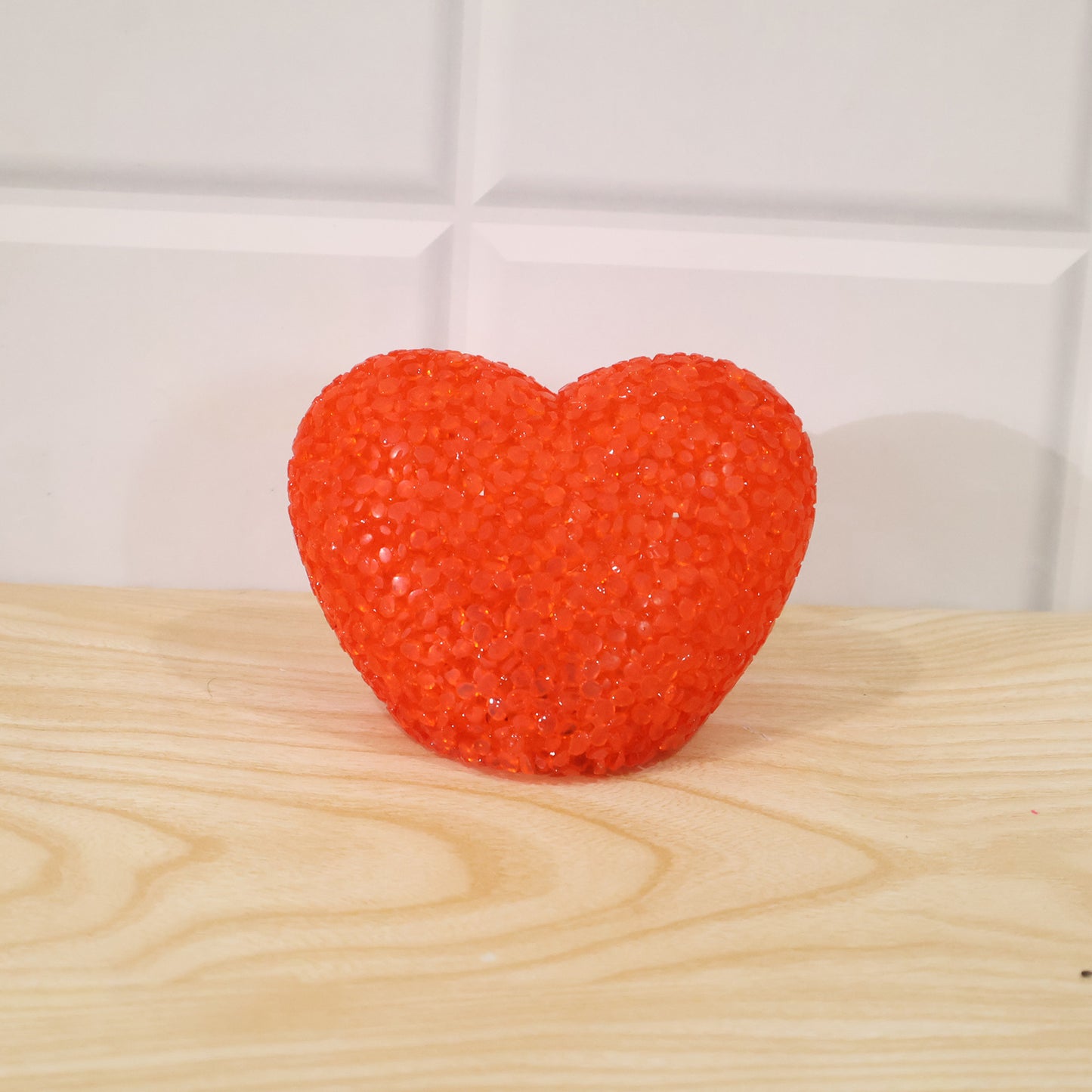 Heart-shaped LED night lamp with crystal texture emitting a soft red glow, perfect for cozy bedroom decor.