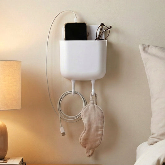 Plastic wall-mounted mobile charging holder by Wukusy, with compartments for organizing and charging smartphones on the wall.