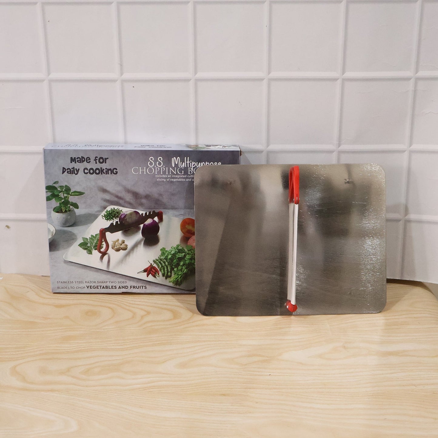 Stainless steel Wukusy multipurpose chopping board, hygienic and durable for kitchen food preparation.