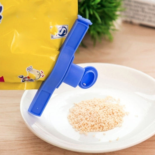 Wukusy 2499 Food Bag Clip Seal for kitchen storage, demonstrating secure sealing of food bags with a plastic clip.