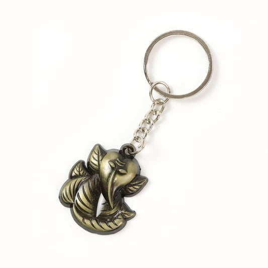 Black metal Ganesh face keychain by Wukusy, antique finish, detailed Hindu deity design, compact and decorative accessory.