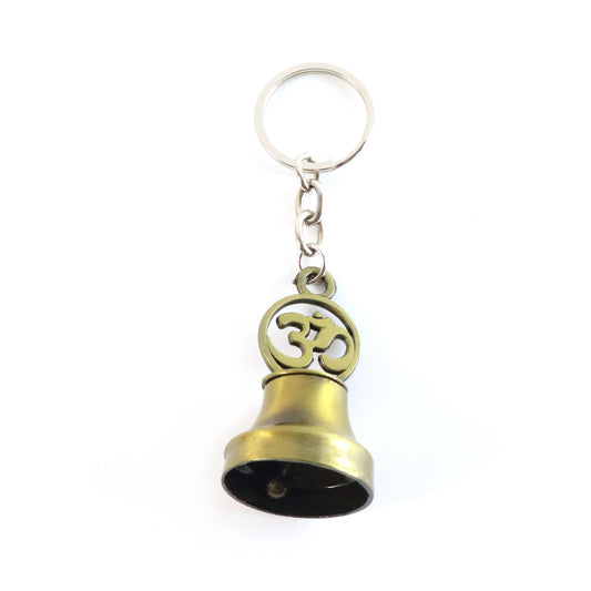 Wukusy Om Symbol Temple Bell metal keychain, travel accessory with engraved Om symbol and small bell, attached to keyring.