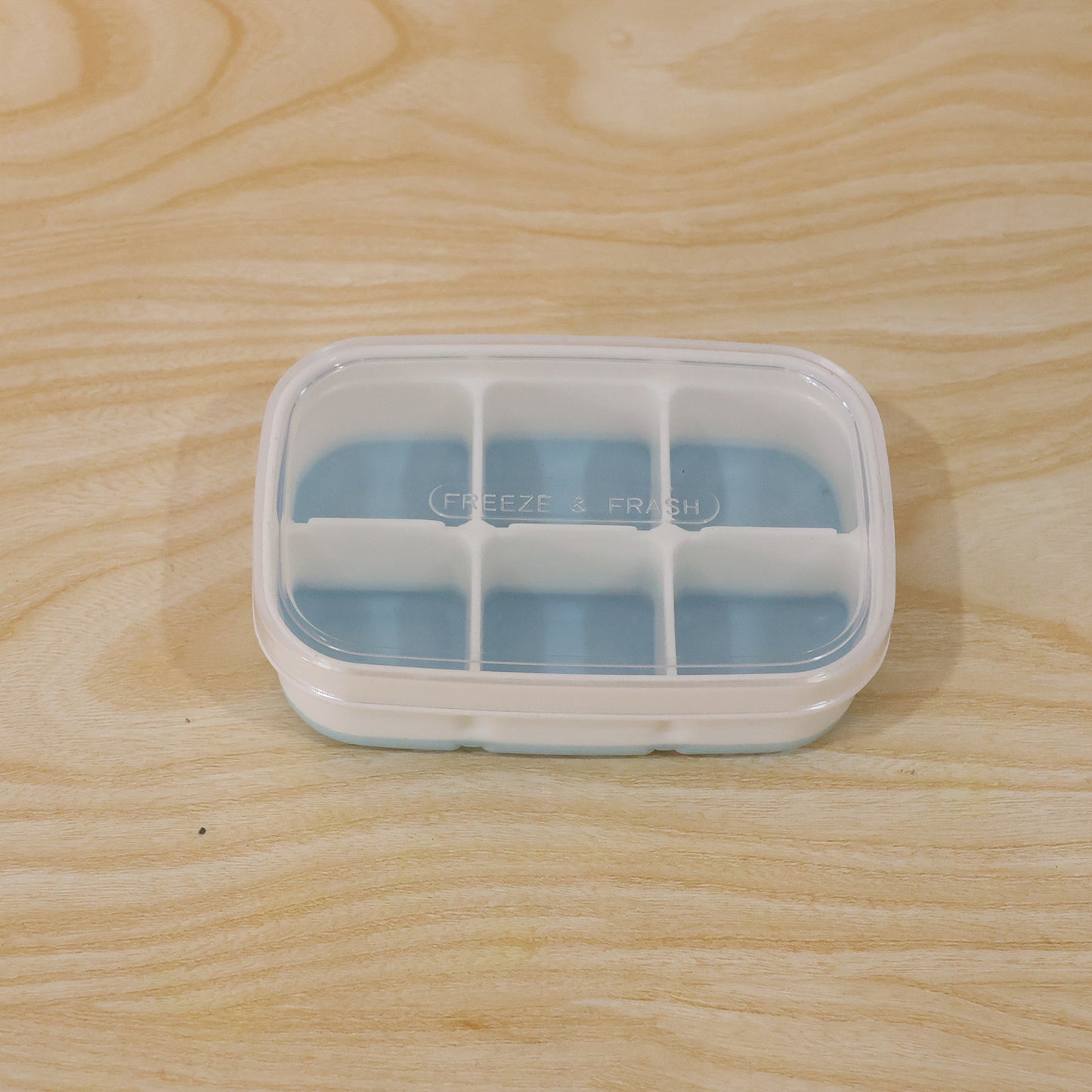 Wukusy Mini Plastic 6 Cavity Ice Tray with compact design for freezing fresh ice cubes in small portions.