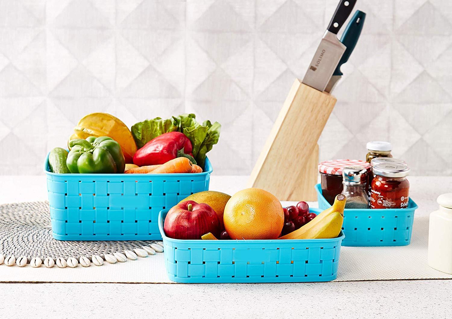 Set of three sky blue Wukusy Smart Baskets for kitchen storage, featuring breathable mesh sides and sturdy handles.
