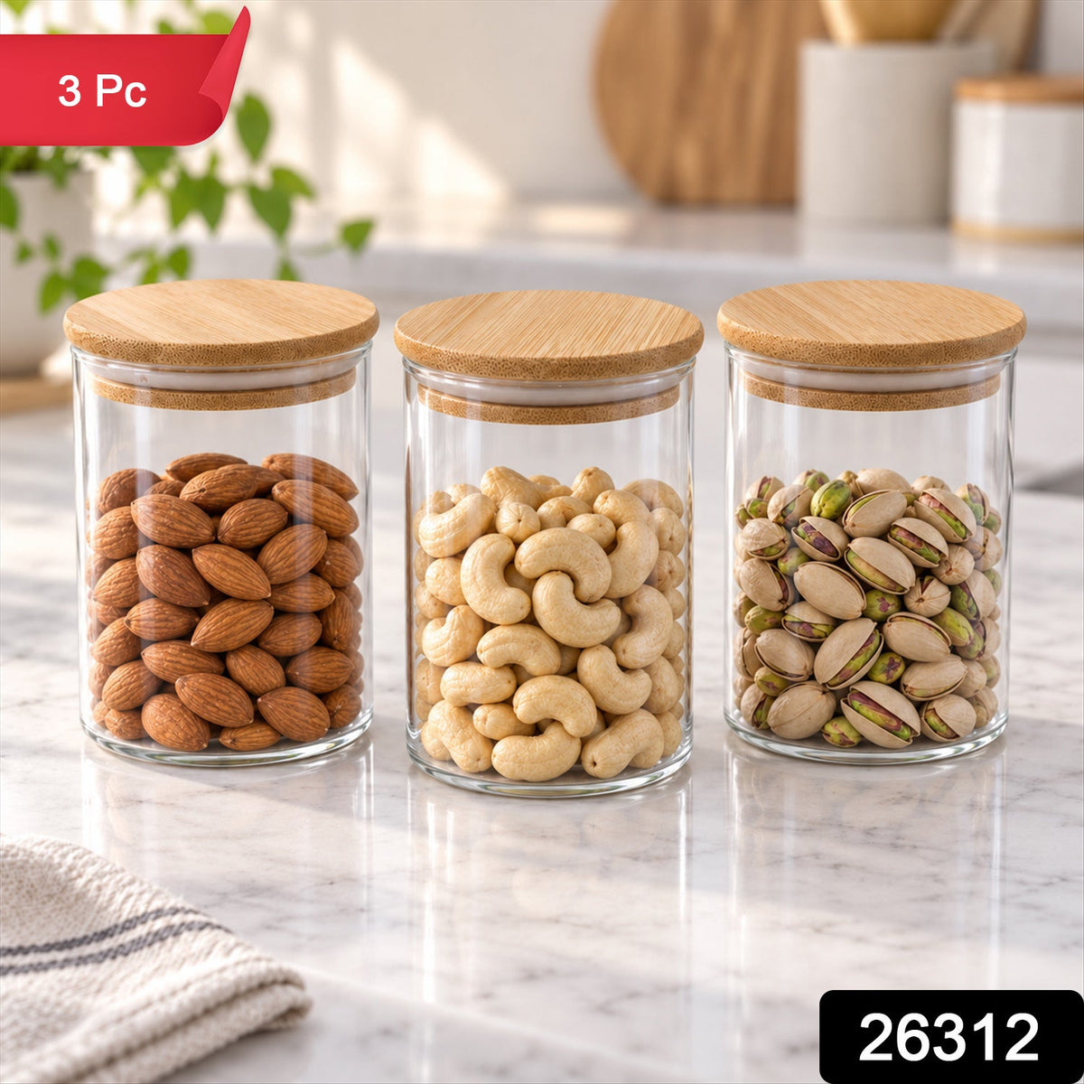 Set of three Wukusy glass storage jars with bamboo lids for kitchen organization and dry fruits storage.