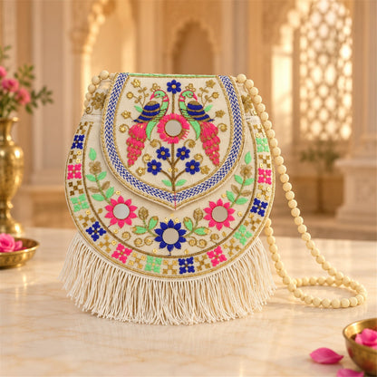 Traditional peacock embroidered jute sling purse with fringe, 24x24 cm, by Wukusy, showcasing intricate embroidery and natural jute texture.