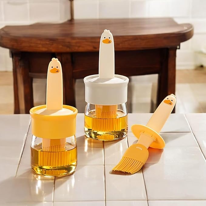 7233 2-in-1 olive oil silicone brush and high-temperature oil bottle for barbecue cooking, with integrated pouring and oil stopper.