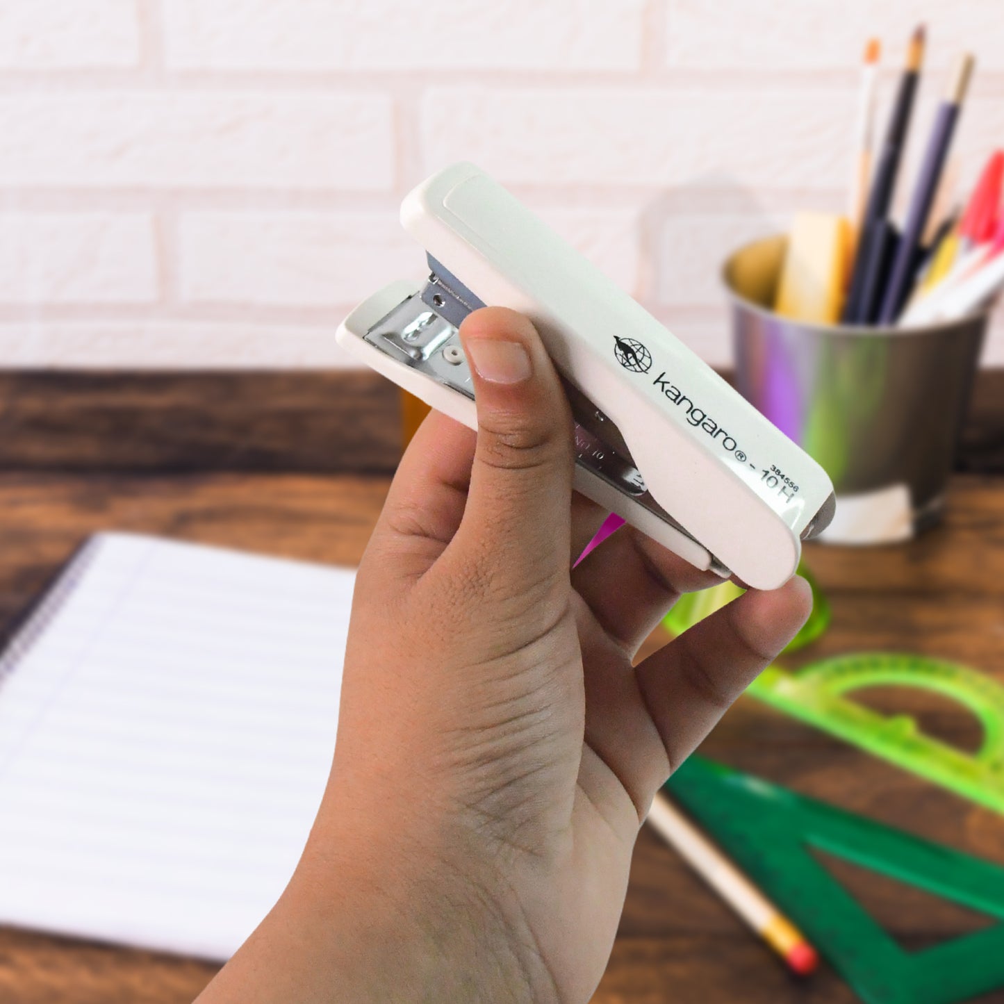Wukusy Kangaro 4-in-1 premium office stationery gift set including pens, notepads, and accessories arranged on a desk.