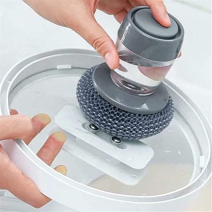 Soap dispensing dish brush with built-in liquid storage and dishwashing lid, ideal for cleaning pots and kitchen dishes.