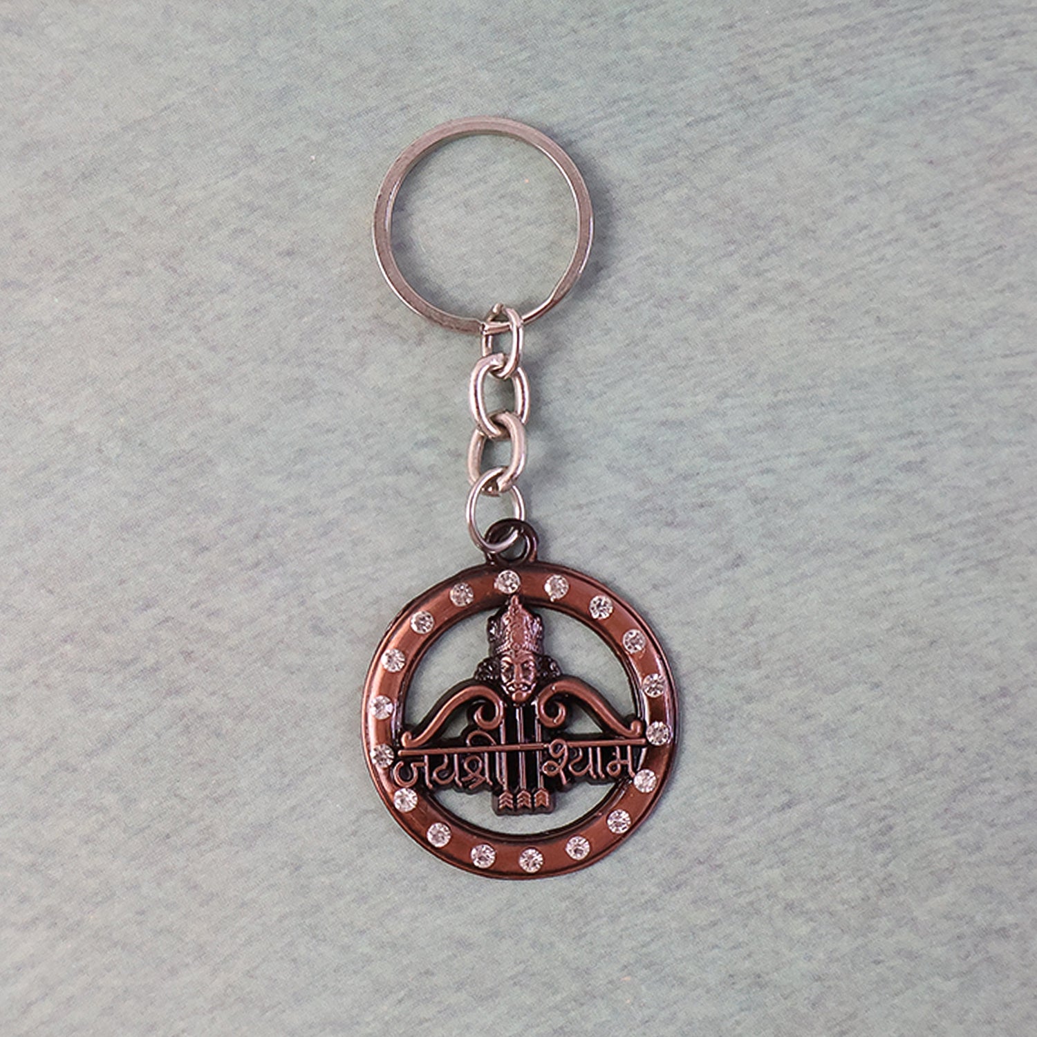 Decorative metal Jai Shree Shyam keychain with intricate design, featuring religious symbols, by Wukusy.
