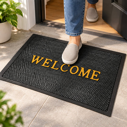 Wukusy welcome door mat with textured mesh, 57x37.5 cm, suitable for home entrance, featuring a friendly message and durable design.