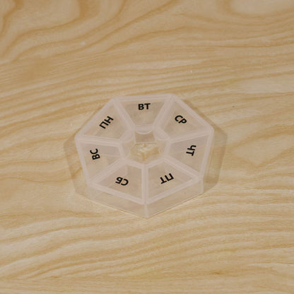 Wukusy medicine pill box with 7 compartments and clear flip lids for weekly travel storage, compact and portable design.
