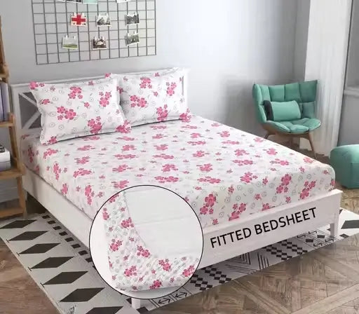 Ekom floral cotton fitted bedsheet in king size with two matching pillow covers, featuring colorful floral pattern and soft fabric.
