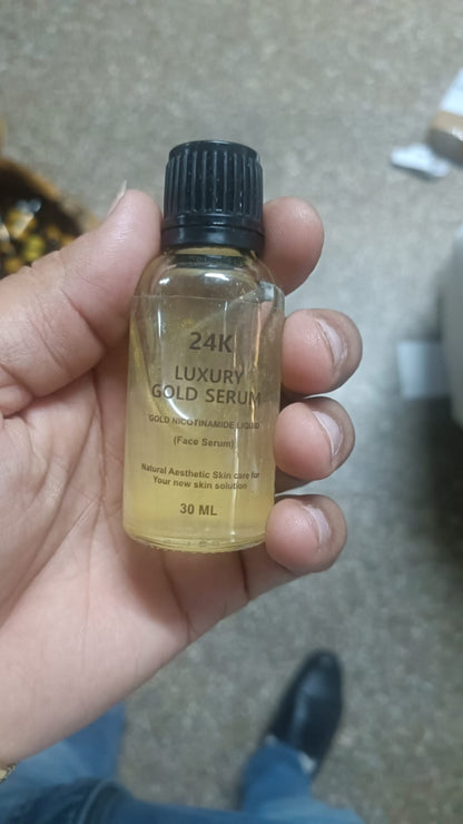 Drpshippr 24K gold face serum in a sleek glass bottle, designed for skincare and facial rejuvenation.