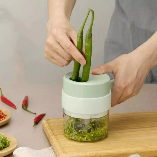 Drpshippr 4-in-1 electric vegetable cutter with blades for slicing, grating, chopping, and dicing in a home kitchen setting.