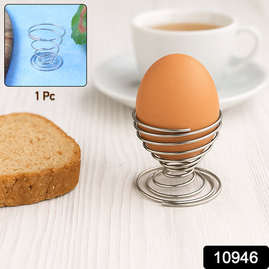 Stainless steel spring egg cup holder by Wukusy, designed for holding a boiled egg securely in a modern kitchen setting.