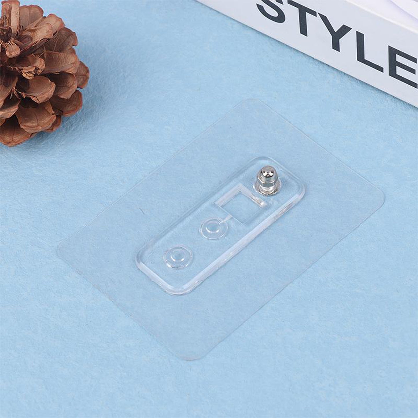Wukusy adhesive plastic wall hook with strong hold, self-stick hanger for storage, shown mounted on a wall.