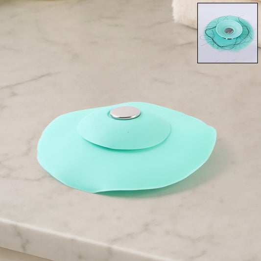 Creative 2-in-1 light green silicone sewer sink sealer cover and drainer for kitchen sinks, by Wukusy, with multicolour accents.