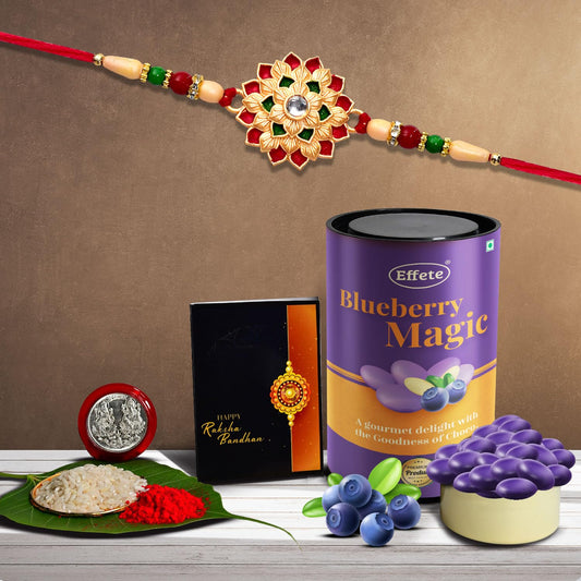 Colorful layered flower Rakhi combo with assorted chocolates, dry fruits, silver coin, and greeting card for brother by Wukusy.