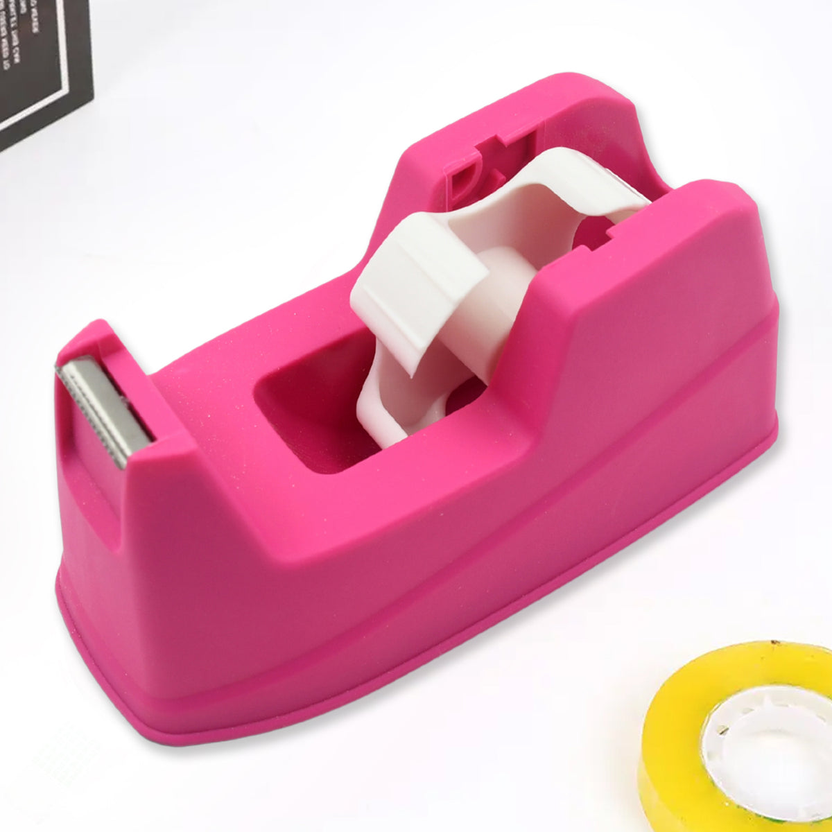 Wukusy 9506 plastic tape dispenser cutter for home office use, with stationary and packaging tape on a clean surface.