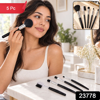Wukusy mini makeup brush set with five compact brushes for face, eye, brow, and lip makeup on a white background.