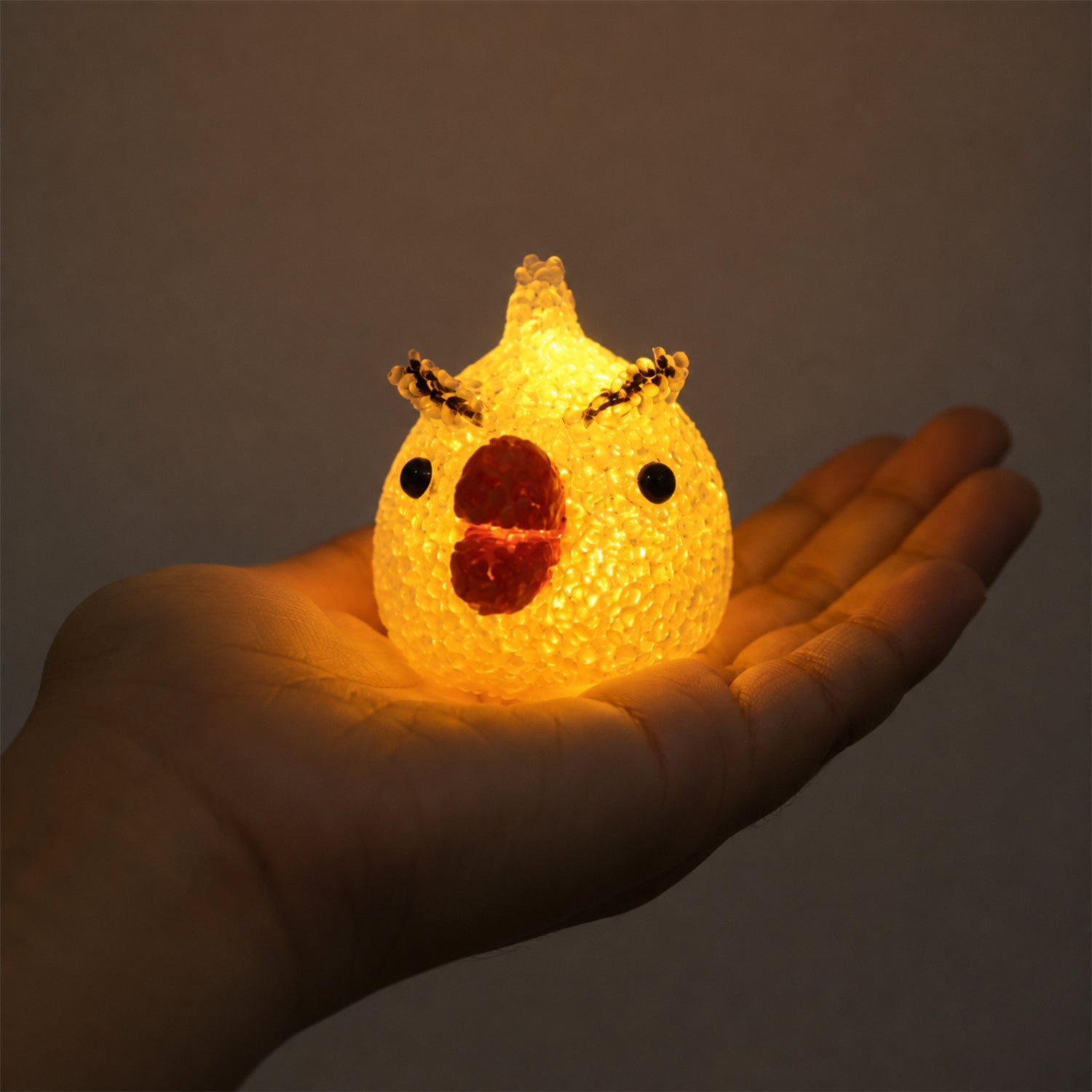 Wukusy cartoon chick shape LED night lamp with crystal texture emitting a warm glow, perfect for cozy bedroom lighting.