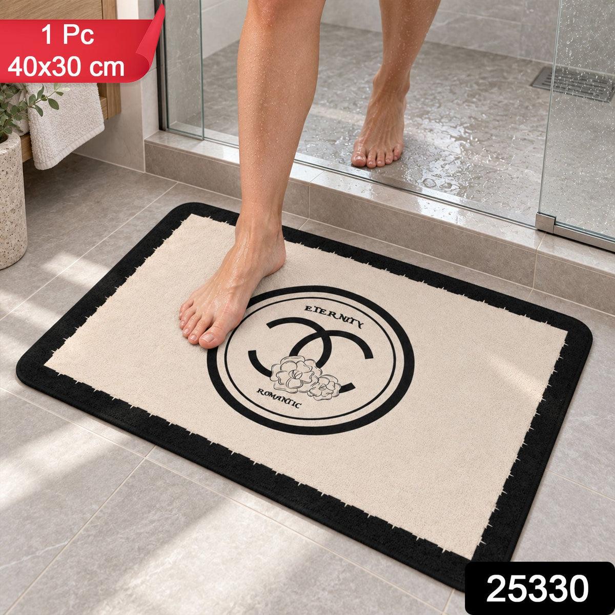 Black and cream Wukusy bath mat with soft, textured surface, absorbent floor rug measuring 40x30 cm.