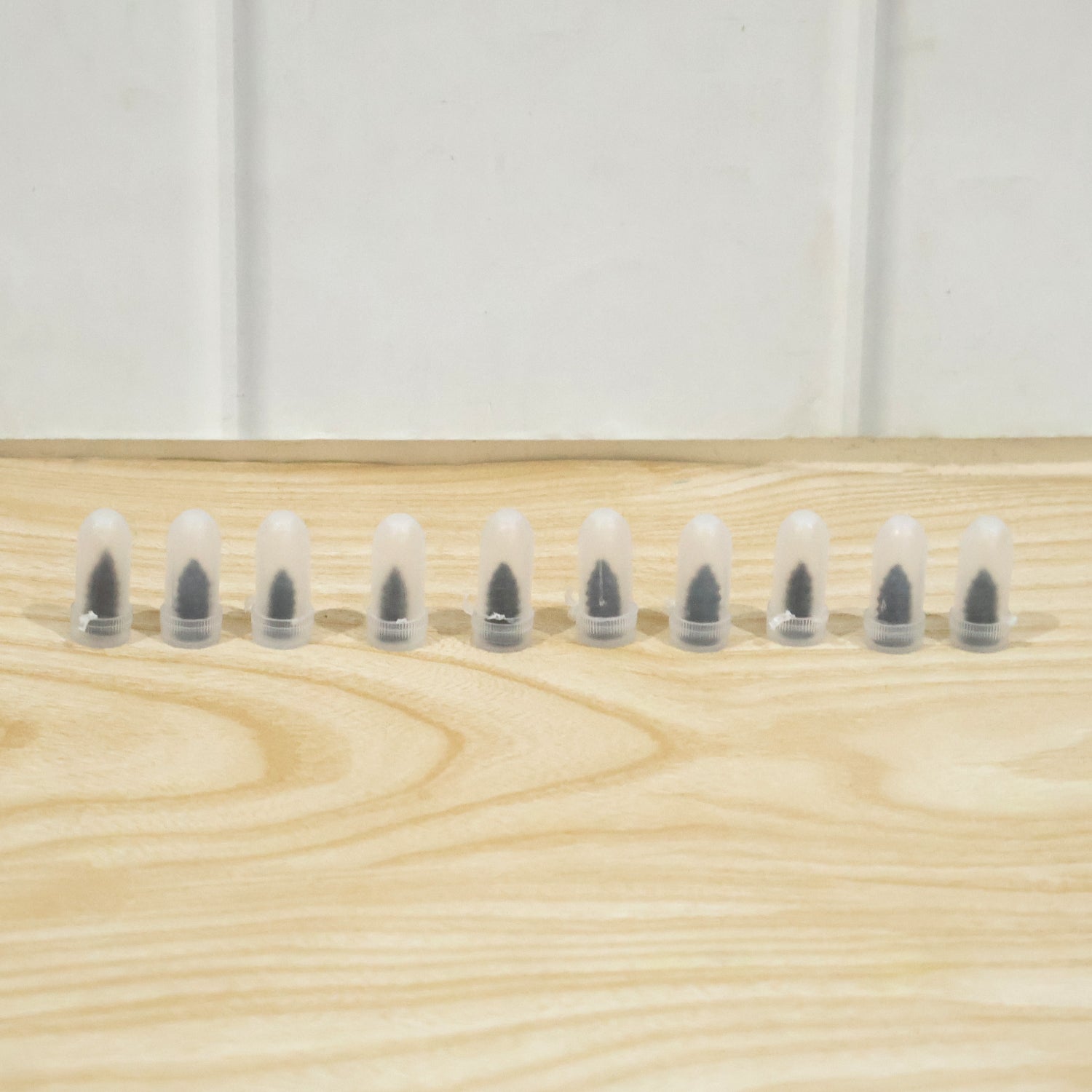 Set of 10 black Wukusy car bike tire puncture repair nails and screws for quick and easy flat tire fixes.