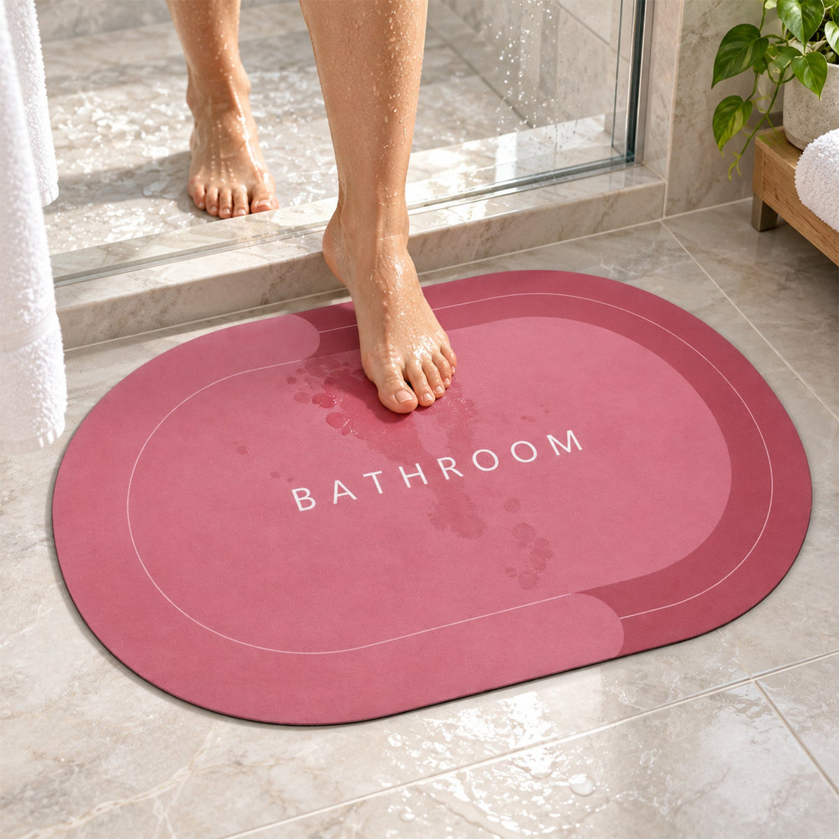 Wukusy two-tone oval bathroom rug with water-absorbing, anti-skid backing, measuring 58.5x39 cm, in natural bathroom setting
